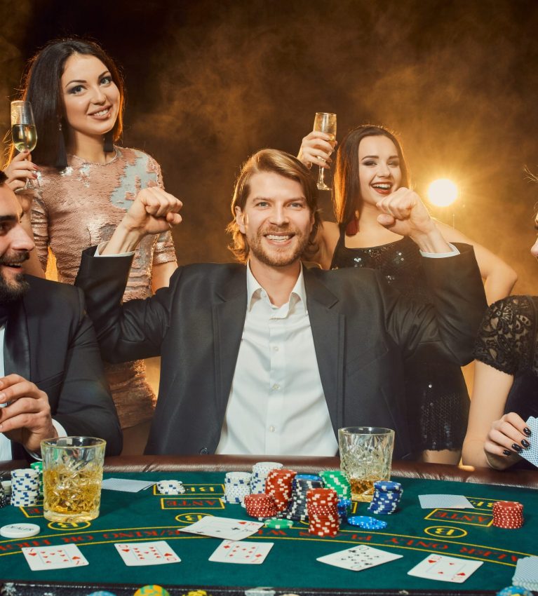 Poker players sitting around a table at a casino. Poker. Gambling. Casino